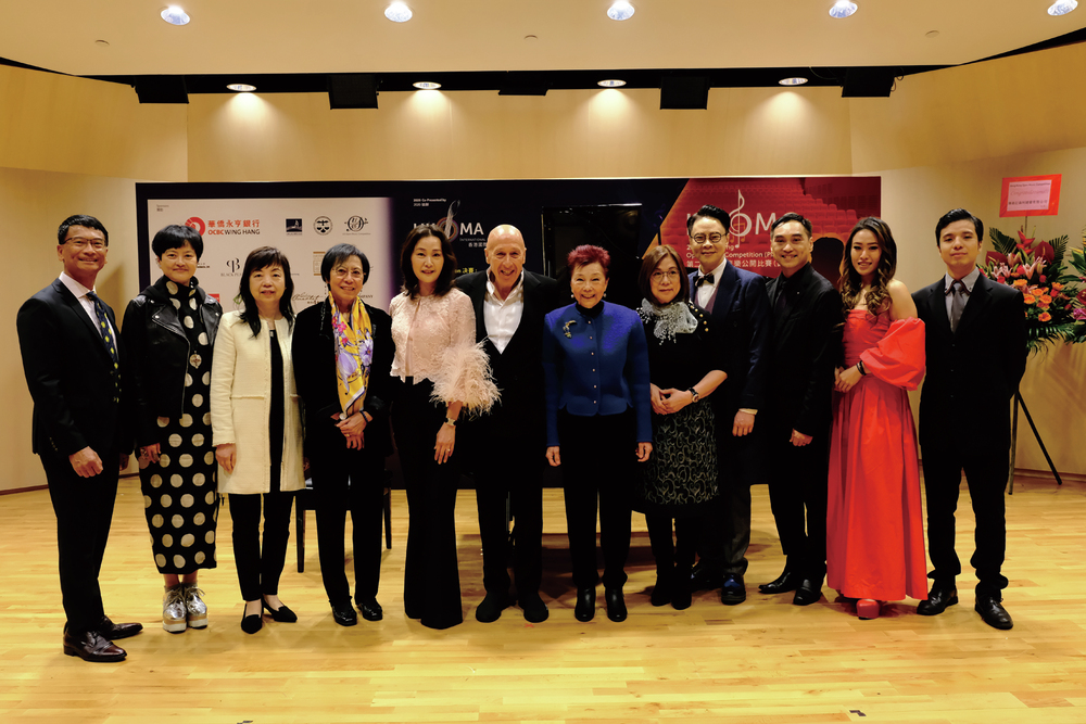 A group photo of members of the organizing committee, international judging panel and sponsors