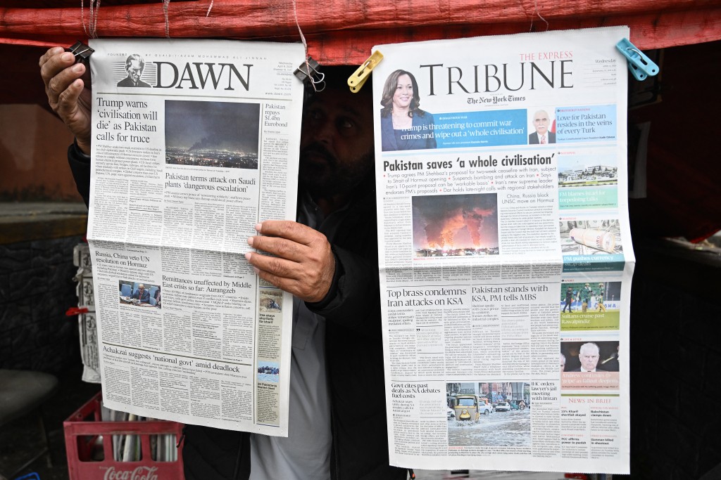 Photo by AAMIR QURESHI / AFP A vendor displays morning newspapers at his roadside stall in Islamabad on April 8, 2026.