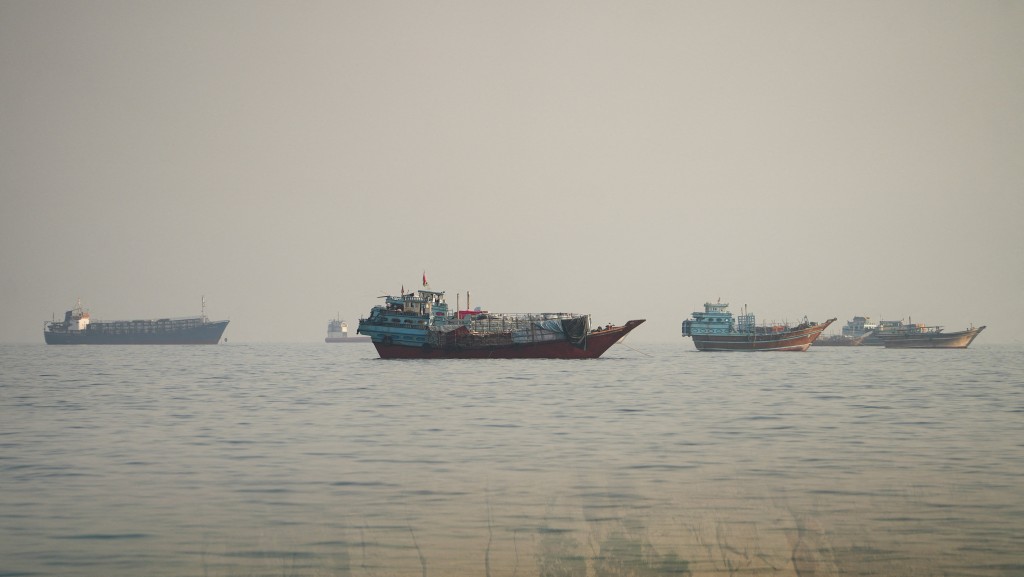 Vessels at the Strait of Hormuz, as seen from Musandam, Oman, September 23, 2026. Picture taken through a window. REUTERS/Stringer