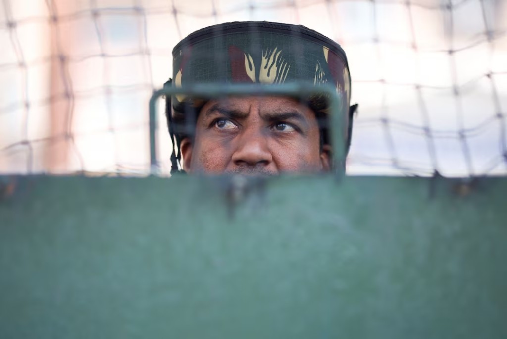 An Indian security force personnel stands guard on a street, following a suspected militant attack near south Kashmir's Pahalgam, in Srinagar, April 28, 2025. (Reuters)
