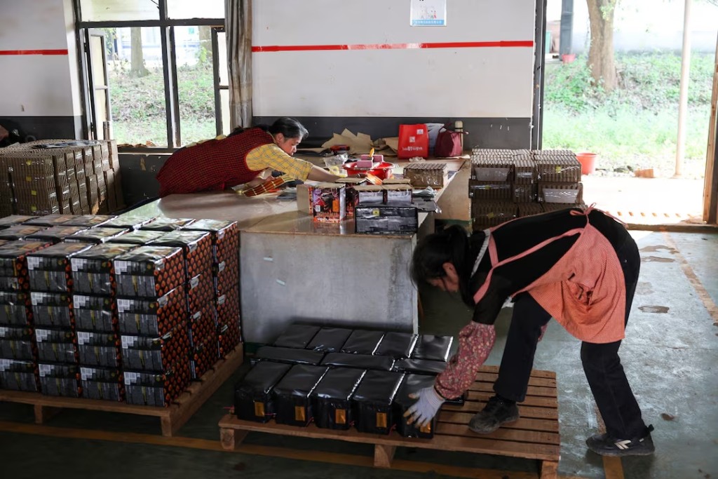 Employees work at Chili Fireworks factory in Liling, Hunan province, China, April 9, 2026. REUTERS/Go Nakamura