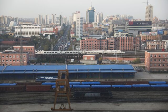 Freight cars are seen at a train station in Dandong, Liaoning province, China April 21, 2021. REUTERS/Tingshu Wang