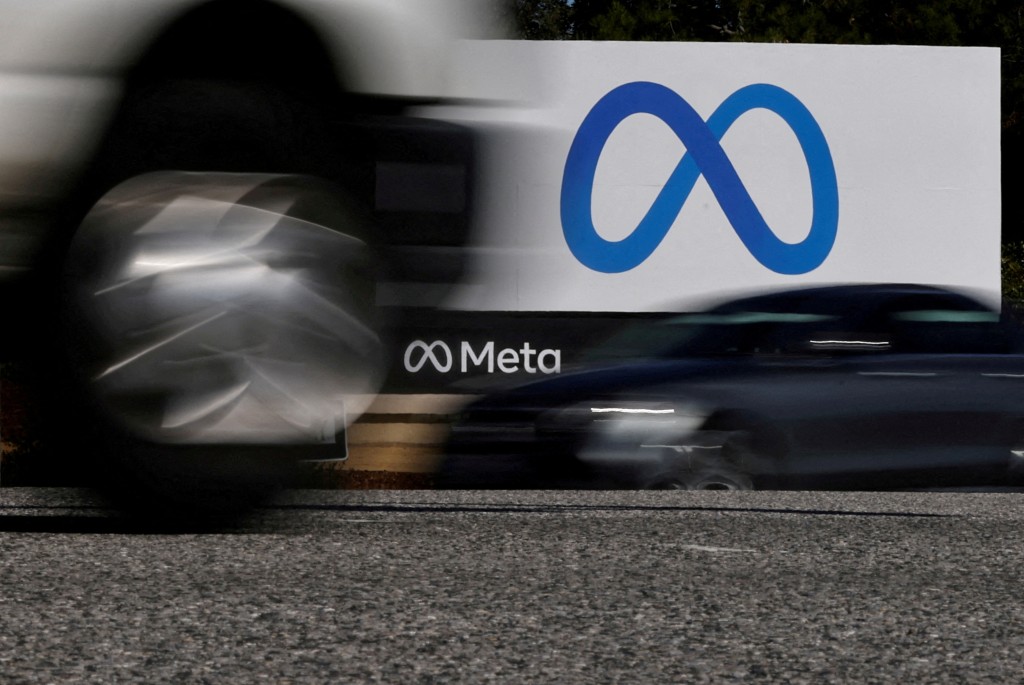Cars drive past a sign of Meta, the new name for the company formerly known as Facebook, at its headquarters in Menlo Park, California, U.S. October 28, 2021. REUTERS