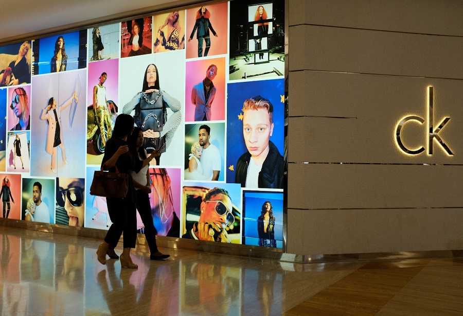 Women walk by a Calvin Klein advertisement. REUTERS Women walk by a Calvin Klein advertisement. REUTERS