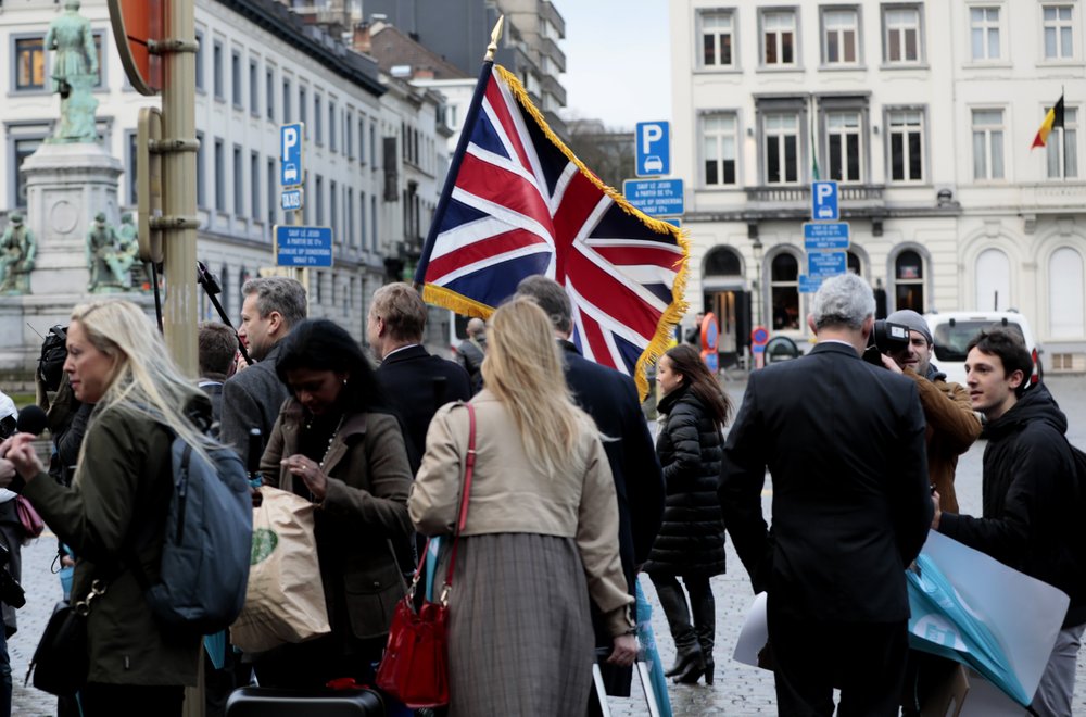 British MEP's carry a Union flag as they march out of European Parliament with their luggage in Brussels to take the Eurostar train back to Britain, Friday. British MEP's carry a Union flag as they march out of European Parliament with their luggage in Brussels to take the Eurostar train back to Britain, Friday.