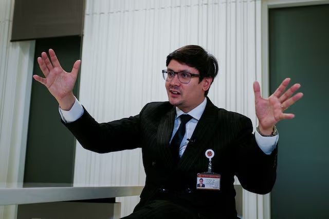 Chair of the House Committee on National Security, Border Affairs, National Strategy and National Reform and a member of the opposition People's Party, Rangsiman Rome, speaks during an interview with Reuters amid a mounting crackdown on scam centres operating along a porous border in Bangkok, Thailand February 26, 2025. REUTERS/Thomas Suen/File Photo 