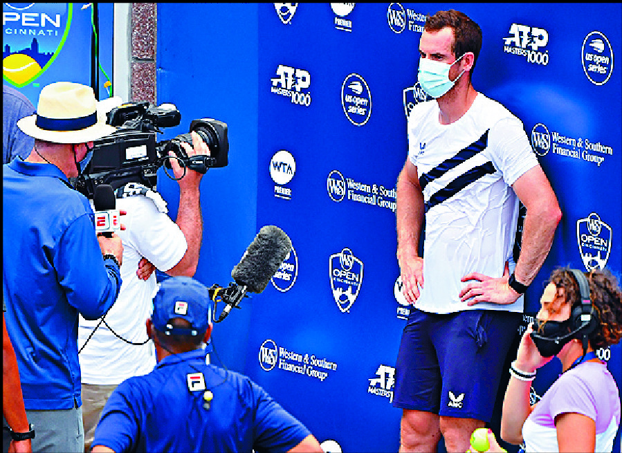 Andy Murray wears a mask during his interview after his first-round win. REUTERS Andy Murray wears a mask during his interview after his first-round win. REUTERS