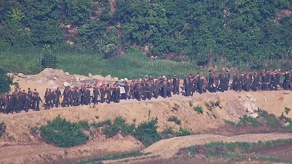 In this undated photo provided on Tuesday, June 18, 2024, by South Korea Defense Ministry, North Korean soldiers work at an undisclosed location near the border area, as seen from a South Korean guard area. South Korean soldiers fired warning shots to repel North Korean soldiers who temporarily crossed the rivals' land border Tuesday for the second time this month, South Korea's military said. (South Korea Defense Ministry via AP) In this undated photo provided on Tuesday, June 18, 2024, by South Korea Defense Ministry, North Korean soldiers work at an undisclosed location near the border area, as seen from a South Korean guard area. South Korean soldiers fired warning shots to repel North Korean soldiers who temporarily crossed the rivals' land border Tuesday for the second time this month, South Korea's military said. (South Korea Defense Ministry via AP)