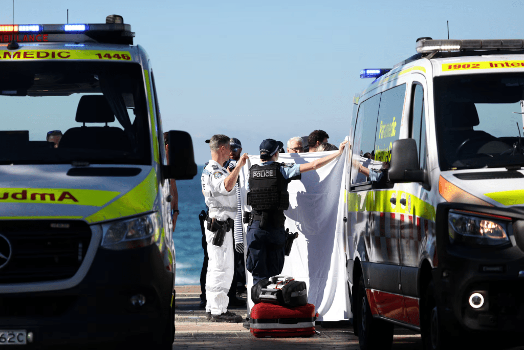 Police and emergency personnel at the scene after reports of a shark attack at Coogee Beach in Sydney, Australia, June 13, 2026. REUTERS/Hollie Adams