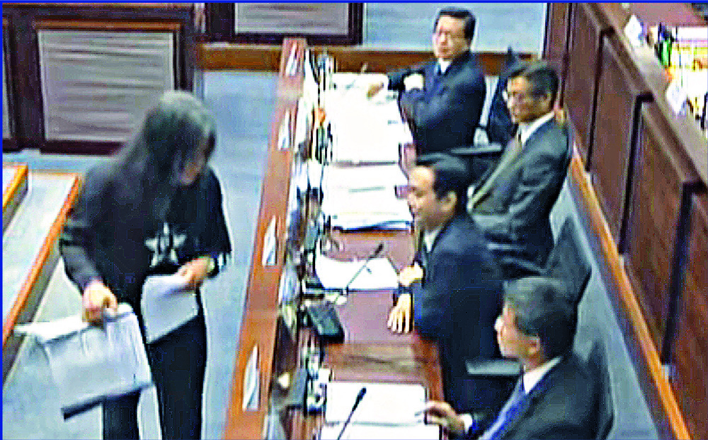 In a video grab, Leung Kwok-hung snatches a folder of documents from Eric Ma in 2016. In a video grab, Leung Kwok-hung snatches a folder of documents from Eric Ma in 2016.