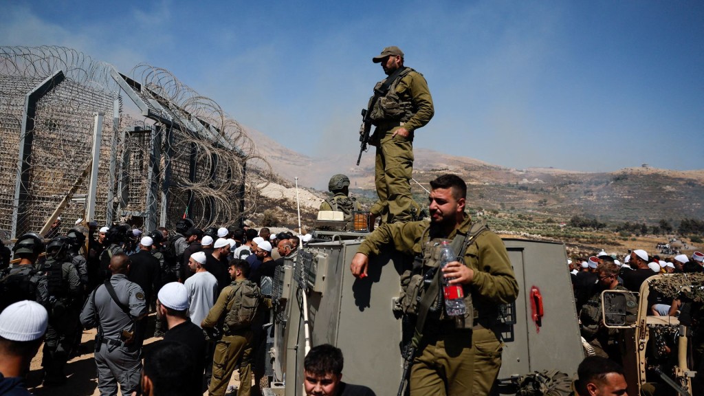 Israeli security forces stand at the ceasefire line between the Israeli-occupied Golan Heights and Syria. Reuters