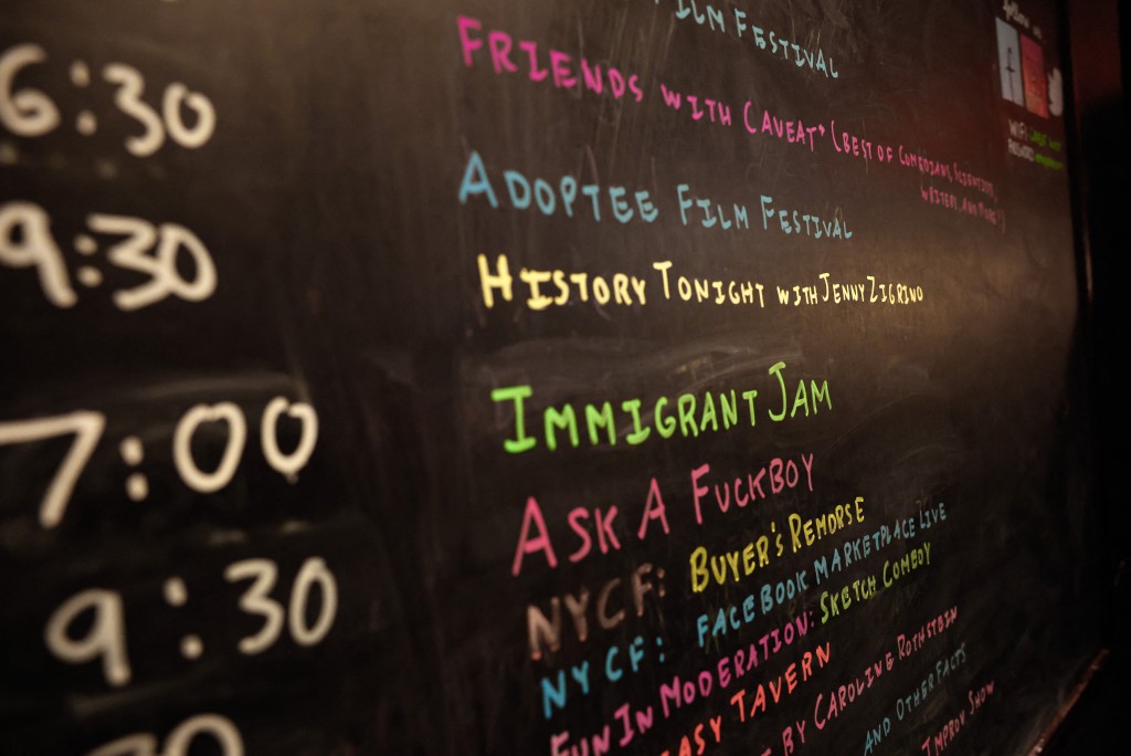 A board displays the scheduled time for an "Immigrant Jam" stand-up comedy show at Caveat Theater in New York on November 7, 2025. (Photo by kena betancur / AFP)