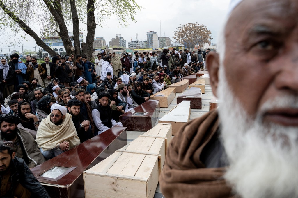 Photo by WAKIL KOHSAR / AFP  Afghan mourners attend the second mass funeral prayer ceremony for victims killed by a Pakistani airstrike that struck a drug rehabilitation center at the Eid Gah Mosque in Kabul on March 26, 2026.