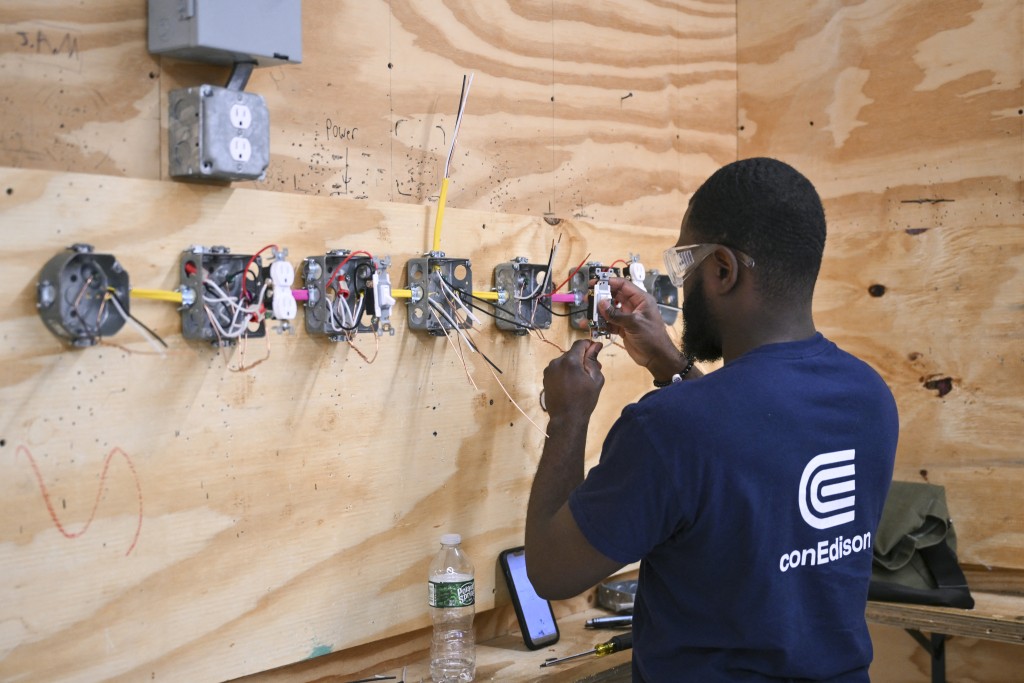 Photo by ANGELA WEISS / AFP A student participates in a hands-on class of the Advanced Electrical program at Apex Technical School in Manhattan, New York, on June 4, 2026.