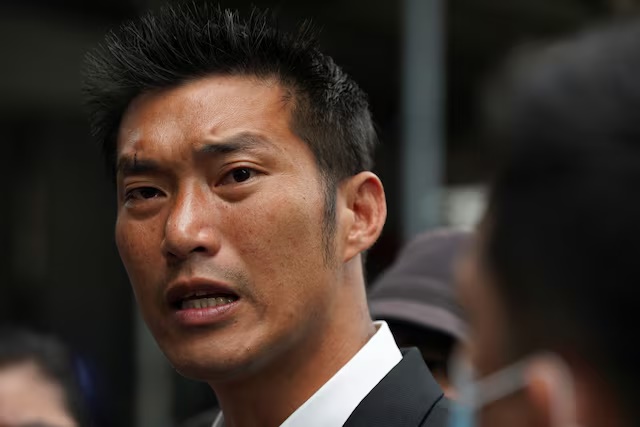 Banned opposition politician Thanathorn Juangroongruangkit turns up at a police station after police charged him with defaming the monarchy, after he accused the government of relying too much on a royal-owned company to produce its supply of coronavirus vaccines, in Bangkok, Thailand, March 30, 2021. REUTERS/Athit Perawongmetha