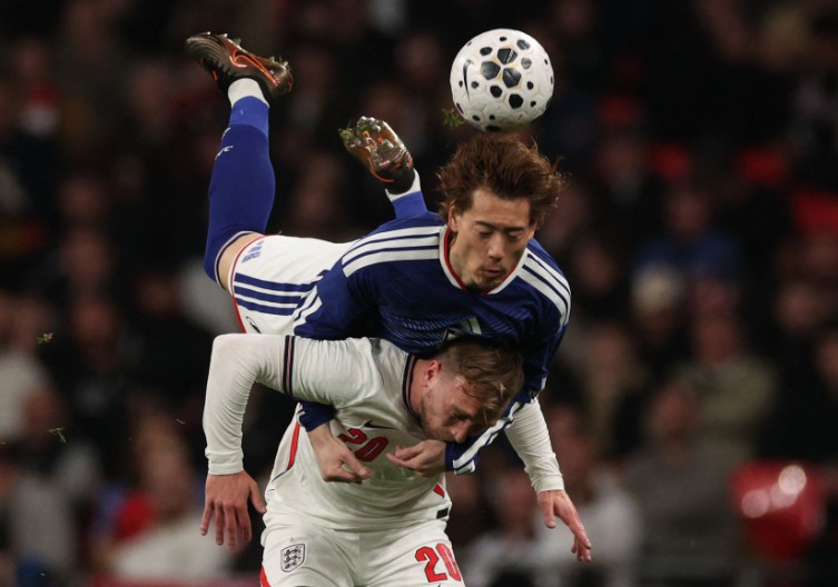 Japan’s defender Ayumu Seko vies with England striker Jarrod Bowen at Wembley. AFP