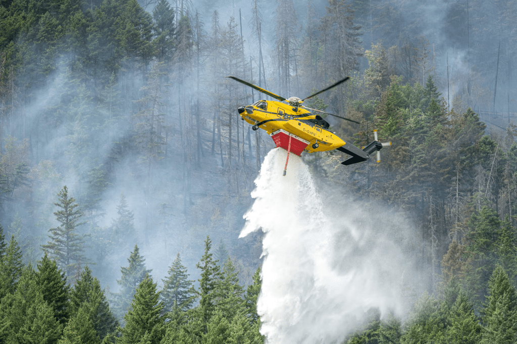 A helicopter drops water on the southern flank of the Brunswick Complex wildfires near North Bend, British Columbia, Canada, July 11, 2026. BC Wildfire/Handout via REUTERS
