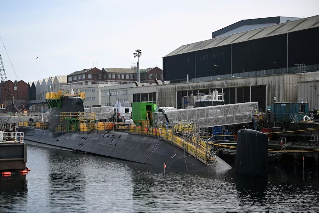 The HMS Agamemnon nuclear submarine is docked outside BAE system factory with members of staff and members of the Royal Navy on the day of the visit of Britain's Prime Minister Keir Starmer, in Barrow-in-Furness, Britain, March 20, 2025. (Reuters)