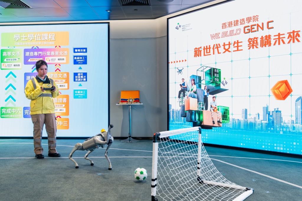 Angel CHAN, a second-year student in the Advanced Diploma performed with robotic dog, demonstrating the latest advancements in construction technology and robotics at the HKIC sharing event. Angel CHAN, a second-year student in the Advanced Diploma performed with robotic dog, demonstrating the latest advancements in construction technology and robotics at the HKIC sharing event.