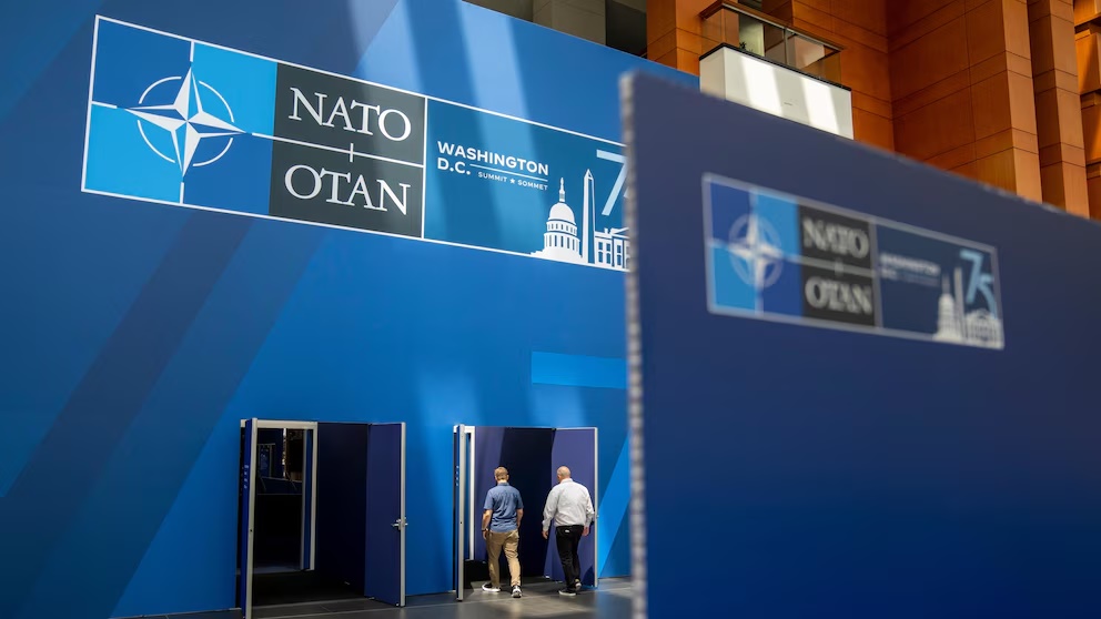 People walk inside of the Walter E. Washington Convention Center, which has been decorated with signage in preparation for the NATO Summit, Monday, July 8, 2024. New Zealand, Japan, South Korea and Australia are sending leaders or their deputies to the NATO summit in Washington this week as the military alliance shows growing interest beyond Europe and the Western Hemisphere. (AP Photo/Jacquelyn Martin) People walk inside of the Walter E. Washington Convention Center, which has been decorated with signage in preparation for the NATO Summit, Monday, July 8, 2024. New Zealand, Japan, South Korea and Australia are sending leaders or their deputies to the NATO summit in Washington this week as the military alliance shows growing interest beyond Europe and the Western Hemisphere. (AP Photo/Jacquelyn Martin)