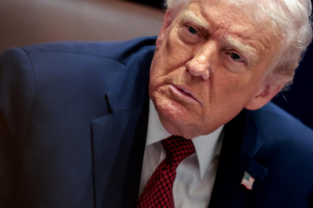FILE PHOTO: U.S. President Donald Trump attends a roundtable discussion on the day he announced an aid package for farmers, at the White House in Washington, D.C., U.S., December 8, 2025. REUTERS/Jonathan Ernst/File Photo