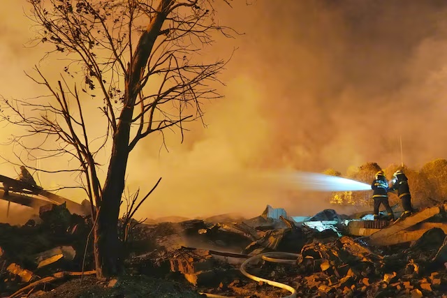 Firefighters work to extinguish a fire following a blast at a fireworks manufacturing factory in Liuyang, Hunan province, China, May 5, 2026. cnsphoto via REUTERS