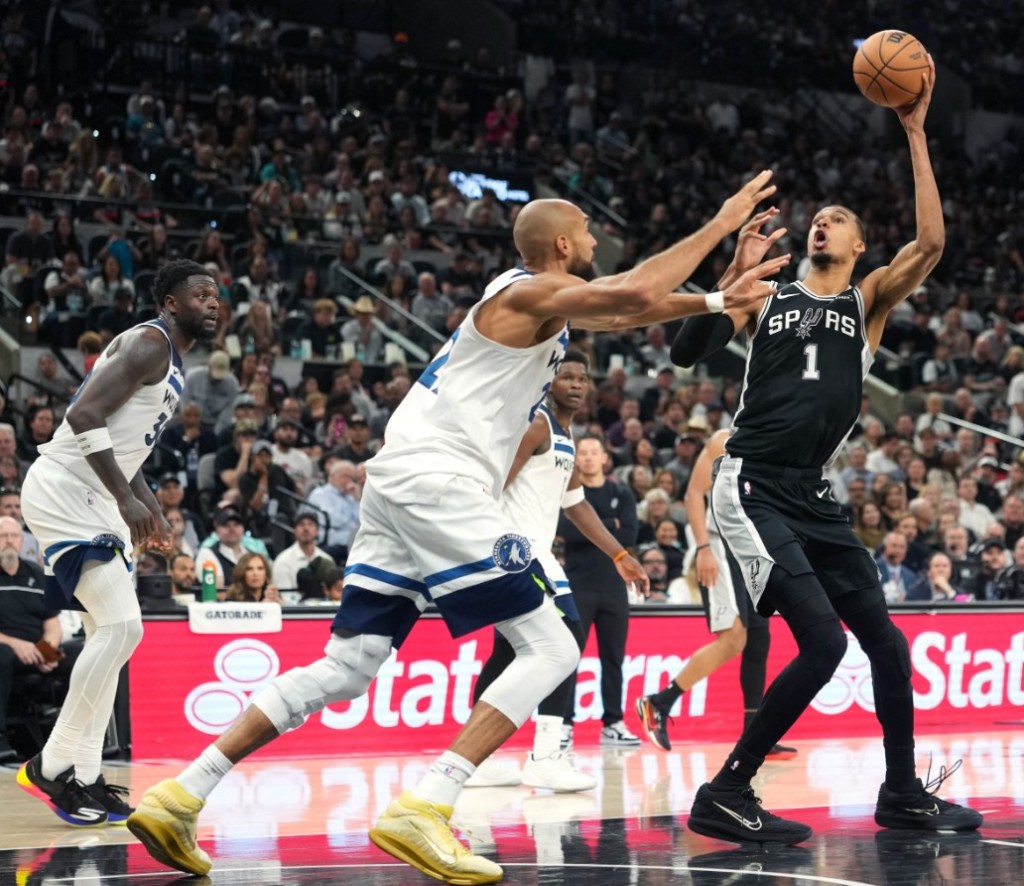 Victor Wembanyama fakes off Minnesota Timberwolves center Rudy Gobert. REUTERS 