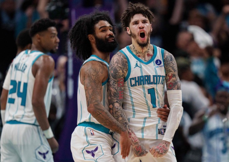  LaMelo Ball celebrates with Coby White, left, in overtime against the Miami Heat. AFP 