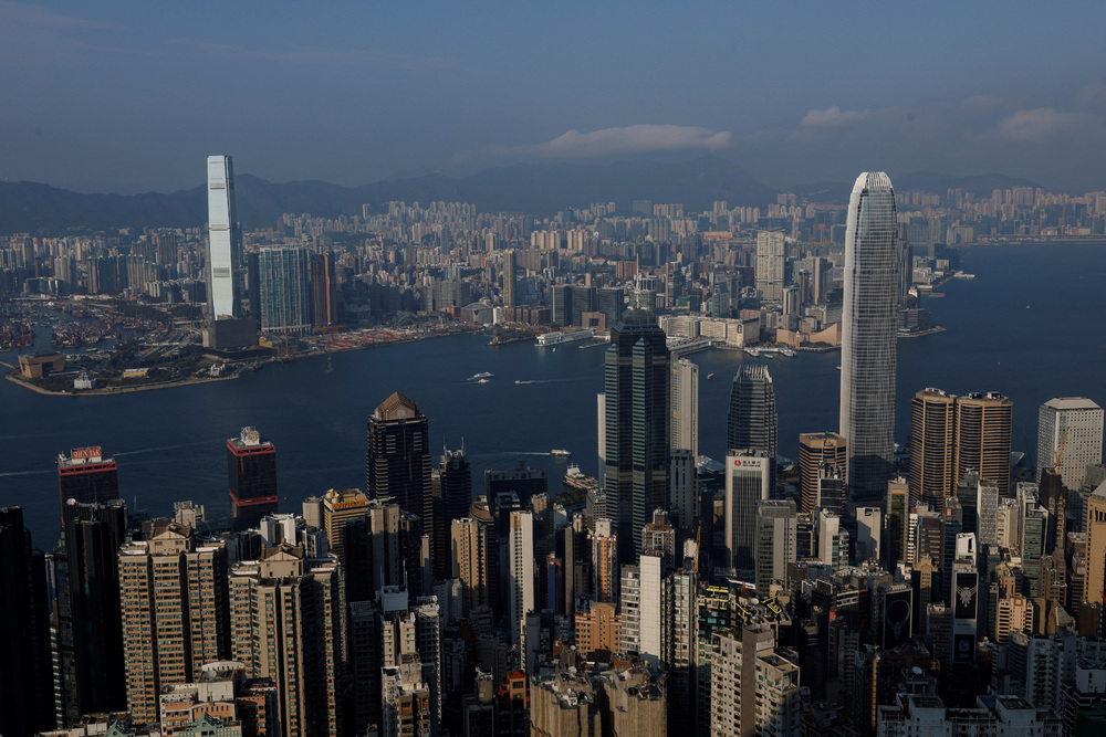 Buildings stand in Hong Kong, China February 24, 2025. REUTERS/Tyrone Siu