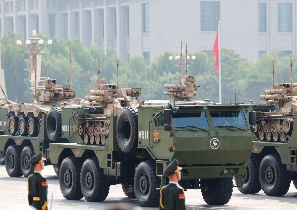 Members of the People's Liberation Army stand as unmanned ground vehicles pass by in a military parade to mark the 80th anniversary of the end of World War Two, in Beijing, China, September 3, 2025. (Reuters)