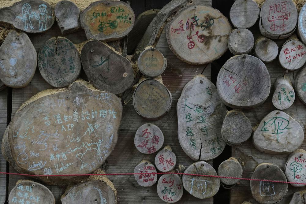 Visitors' notes are displayed in the Chi Kee Sawmill & Timber in Hong Kong, Tuesday, July 12, 2022. Chi Kee Sawmill & Timber, Hong Kong's last operating sawmill, has operated in the city for nearly four decades. But soon, the sawmill could be forced to shut down as authorities look to develop the area to make it more metropolitan and integrate it better with mainland China. (AP Photo/Kin Cheung) Visitors' notes are displayed in the Chi Kee Sawmill & Timber in Hong Kong, Tuesday, July 12, 2022. Chi Kee Sawmill & Timber, Hong Kong's last operating sawmill, has operated in the city for nearly four decades. But soon, the sawmill could be forced to shut down as authorities look to develop the area to make it more metropolitan and integrate it better with mainland China. (AP Photo/Kin Cheung)