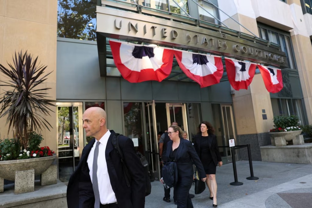 Paul Schmidt, an attorney representing Meta, and Meta’s defense team leave the federal courthouse where a trial over allegations that Meta designed Facebook and Instagram to be addictive to children takes place, in Oakland, California, U.S., August 12, 2026. REUTERS/Manuel Orbegozo