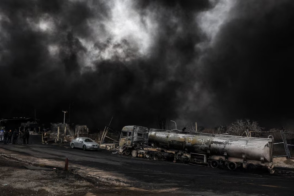 Smoke rises after a reported strike on Shahran fuel tanks in Tehran, Iran, March 8. Majid Asgaripour/WANA