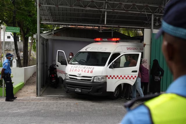 An ambulance carrying the body of one of the five Italian scuba divers who died in an accident in underwater caves, arrives at a mortuary in Male, Maldives, May 19, 2026. REUTERS/Thilina Kaluthotage 