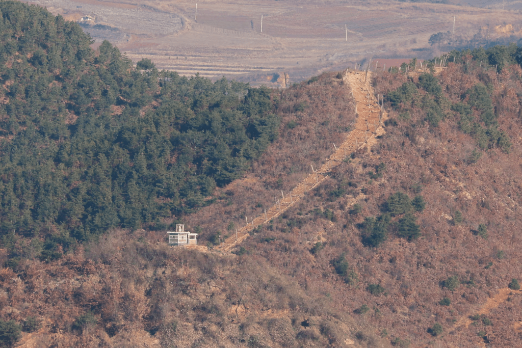 A view shows North Korea's guard post in this picture taken from the top of the Aegibong Peak Observatory, south of the demilitarised zone (DMZ), separating the two Koreas in Gimpo, South Korea, November 29, 2024. REUTERS/Kim Soo-hyeon/File Photo