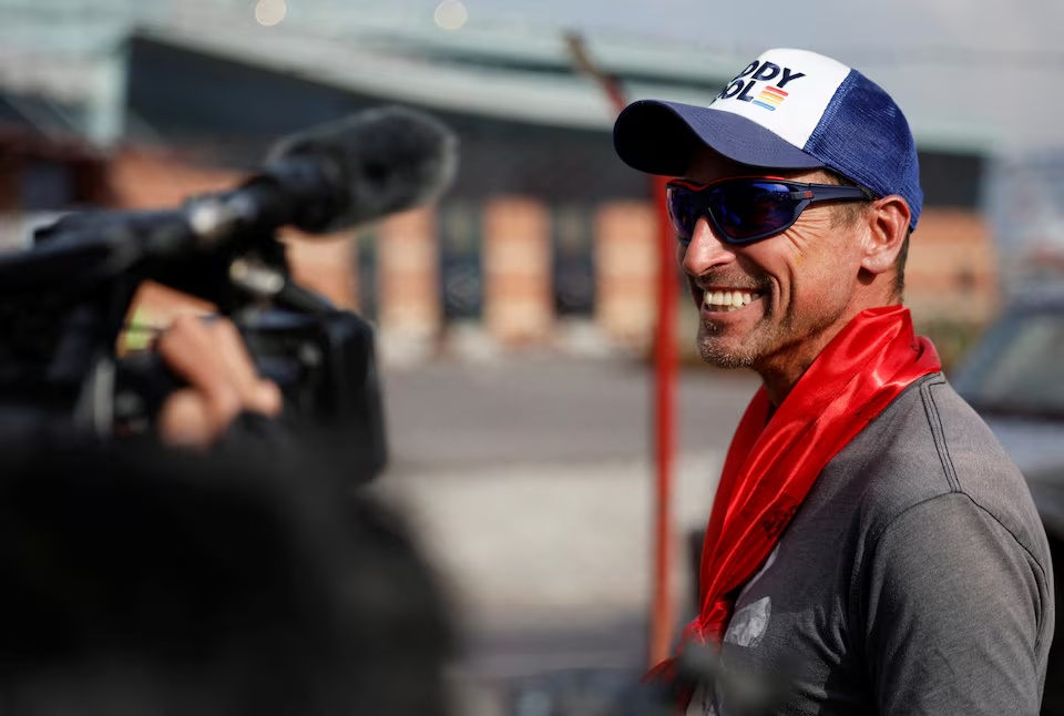 British climber Kenton Cool, 49, smiles while he speaks with the media personnel, upon his arrival at the airport, as he returns after completing his 17th ascent of Mount Everest, which is the most by any foreign climber, in Kathmandu, Nepal May 19, 2023. REUTERS/Navesh Chitrakar
