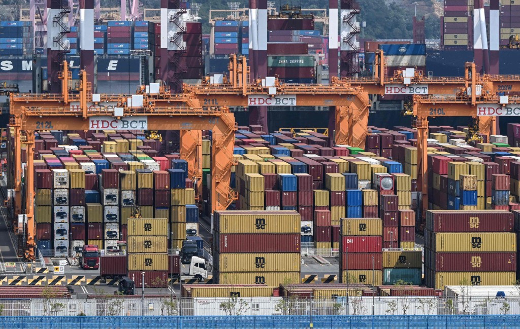 This general view shows shipping containers and cranes at Busan New Port in Busan on August 22, 2026. AFP