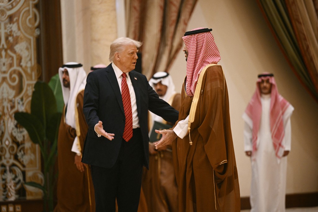 Photo by BRENDAN SMIALOWSKI / AFP US President Donald Trump speaks with Saudi Crown Prince Mohammed bin Salman before posing for a family picture with Gulf leaders during a gathering of the six-nation Gulf Cooperation Council (GCC) in Riyadh on May 14, 2025.