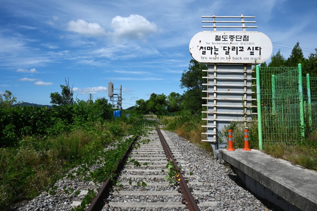 Photo by GREG BAKER / AFP  Train tracks are seen at the Baengmagoji Station in Cheorwon, Gangwon Province in South Korea, near the demilitarized zone separating North and South Korea on August 10, 2026.
