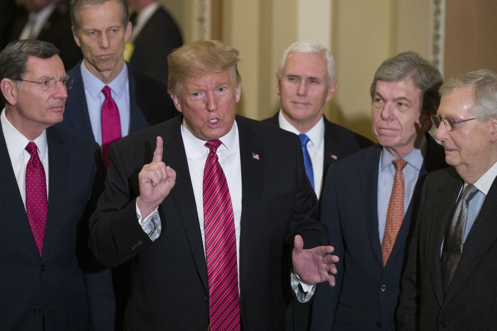 In this Wednesday, January 9, 2019 file photo, Senator John Barrasso, left, and Senator John Thune, stand with President Donald Trump, Vice President Mike Pence, Senator Roy Blunt, and Senate Majority Leader Mitch McConnell. Trump was speaking after a Senate Republican Policy luncheon, on Capitol Hill in Washington. In this Wednesday, January 9, 2019 file photo, Senator John Barrasso, left, and Senator John Thune, stand with President Donald Trump, Vice President Mike Pence, Senator Roy Blunt, and Senate Majority Leader Mitch McConnell. Trump was speaking after a Senate Republican Policy luncheon, on Capitol Hill in Washington.