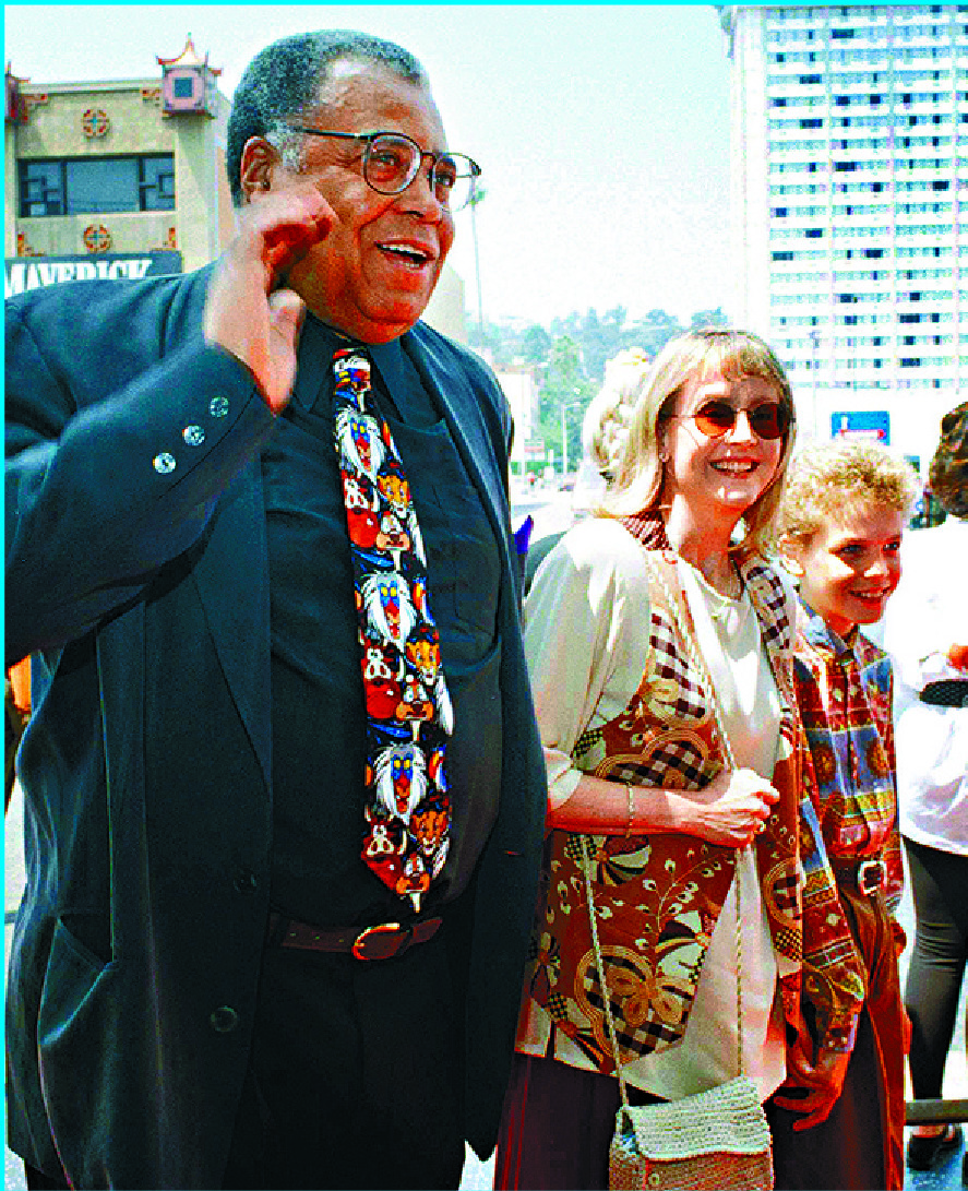 James Earl Jones with wife Cecilia and son Flynn at The Lion King premiere in 1994 and with Julie Harris, Angela Lansbury and Jerry Orbach at the 1969 Tony Awards. AP