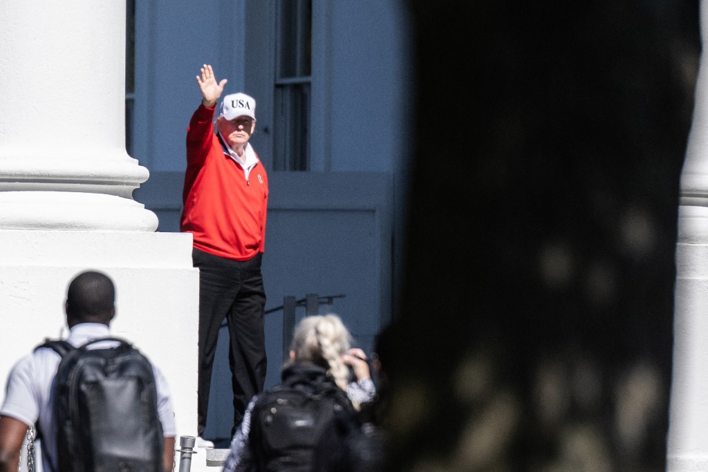 U.S. President Donald Trump waves as he returns to the White House after spending the day at Trump National Golf Club in Sterling, Virginia on May 31, 2026 in Washington, DC.  (AFP)