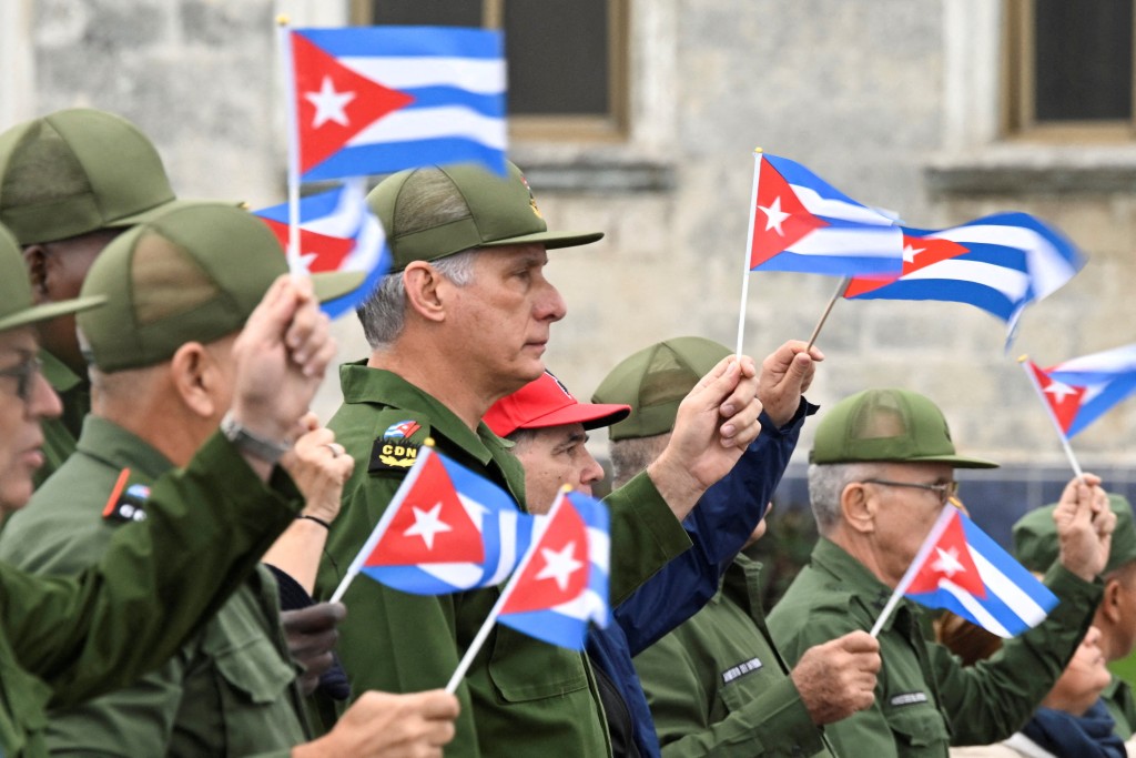 Cuba's President Miguel Diaz-Canel waves a Cuban flag alongwith others during a march outside the U.S. Embassy to protest against what they denounce as U.S. aggression in the region, following the capture of Venezuelan leader Nicolas Maduro and his wife, Cilia Flores, and the killing of Cuban soldiers in the U.S. strike, in Havana, Cuba, January 16, 2026. (Reuters)