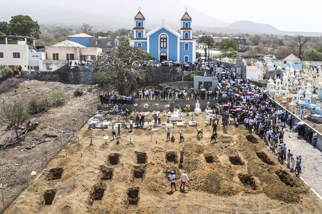An aerial view of residents and relatives of the victims killed in a bus crash gathering during their funeral at Sao Lourenco Church in the town of Sao Lourenco, on the island of Fogo, on September 6, 2026. (AFP)