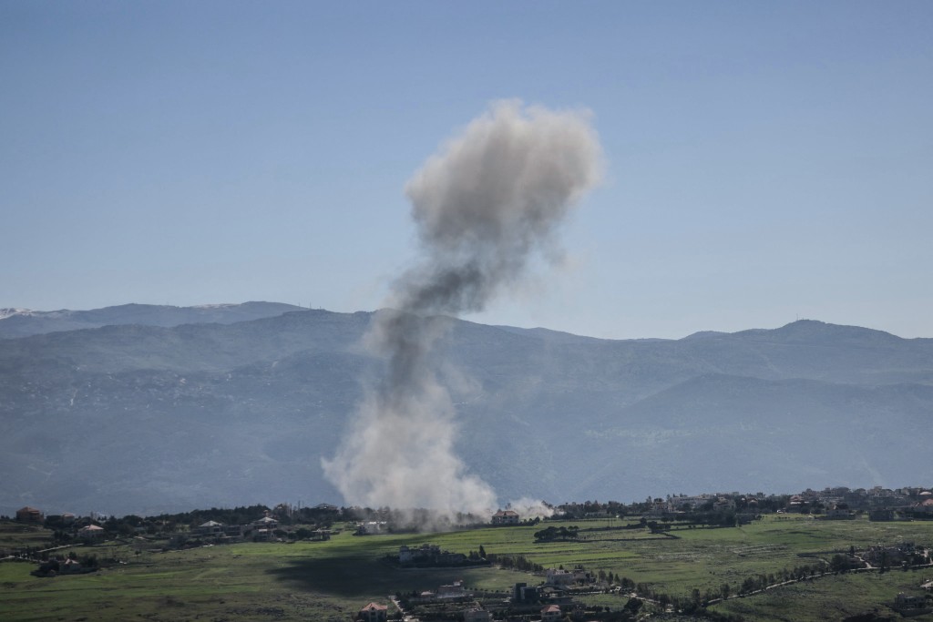 Photo by - / AFP  Smoke rises from the site of an Israeli airstrike that targeted an area in the southern Lebanese border village of Khiam on March 17, 2026.