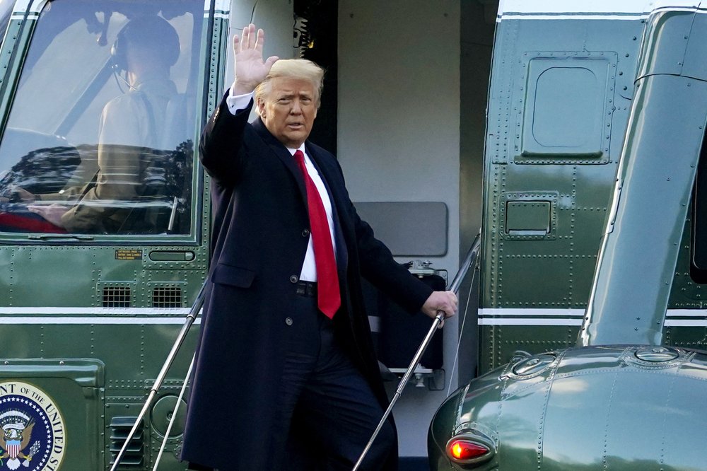 In this Wednesday, January 20, 2021, file photo, President Donald Trump waves as he boards Marine One on the South Lawn of the White House, in Washington, en route to his Mar-a-Lago Florida Resort. In this Wednesday, January 20, 2021, file photo, President Donald Trump waves as he boards Marine One on the South Lawn of the White House, in Washington, en route to his Mar-a-Lago Florida Resort.