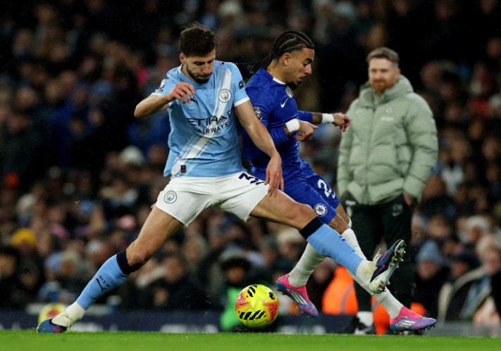 Ruben Dias, left, in action against Malo Gusto, suffered his injury during the game against Chelsea. REUTERS