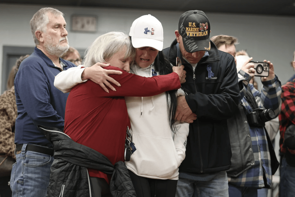 People gather for a vigil in honor of National Guard member Specialist Sarah Beckstrom, one of two National Guard members who were shot in Washington on Wednesday, in Webster Springs, W.Va., Friday, Nov. 28, 2025. (AP Photo/Kathleen Batten)