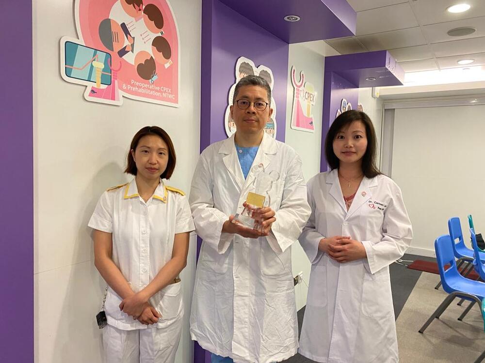 Showing the award are, from left, Aggie Kwan, Angus Chu and Carmen Lam. Showing the award are, from left, Aggie Kwan, Angus Chu and Carmen Lam.