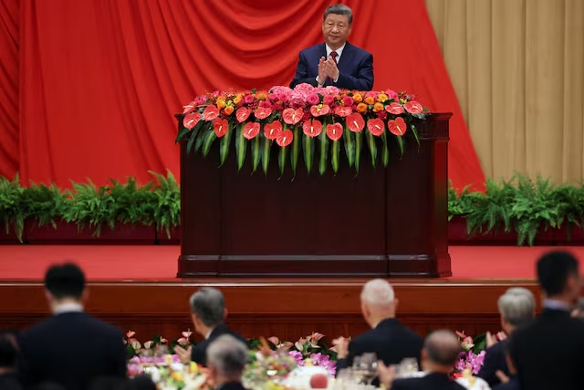 Chinese President Xi Jinping applauds as he delivers a speech at the National Day reception on the eve of the 77th founding anniversary of the People's Republic of China, at the Great Hall of the People in Beijing, China September 30, 2026. REUTERS/Florence Lo/Pool